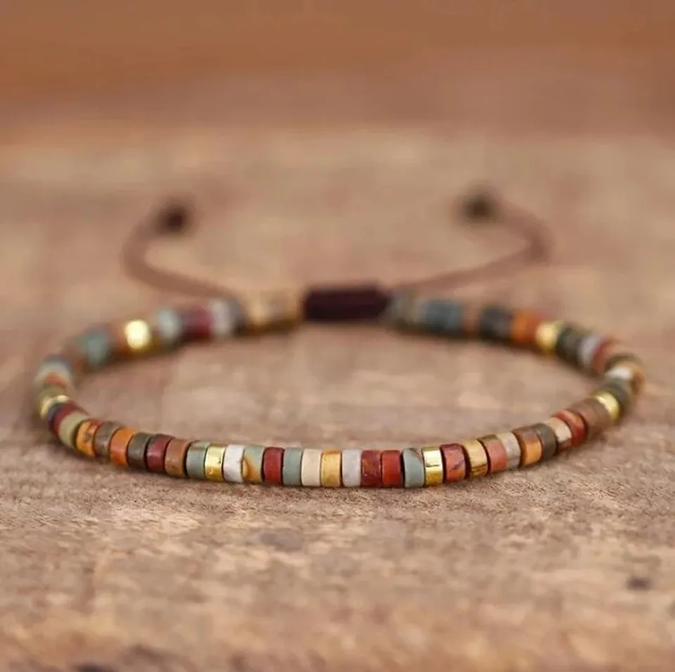 close up of a beaded bracelet on a wooden table