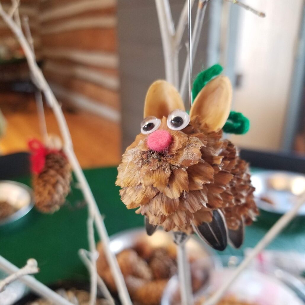 pincone mouse craft hanging on a stick tree