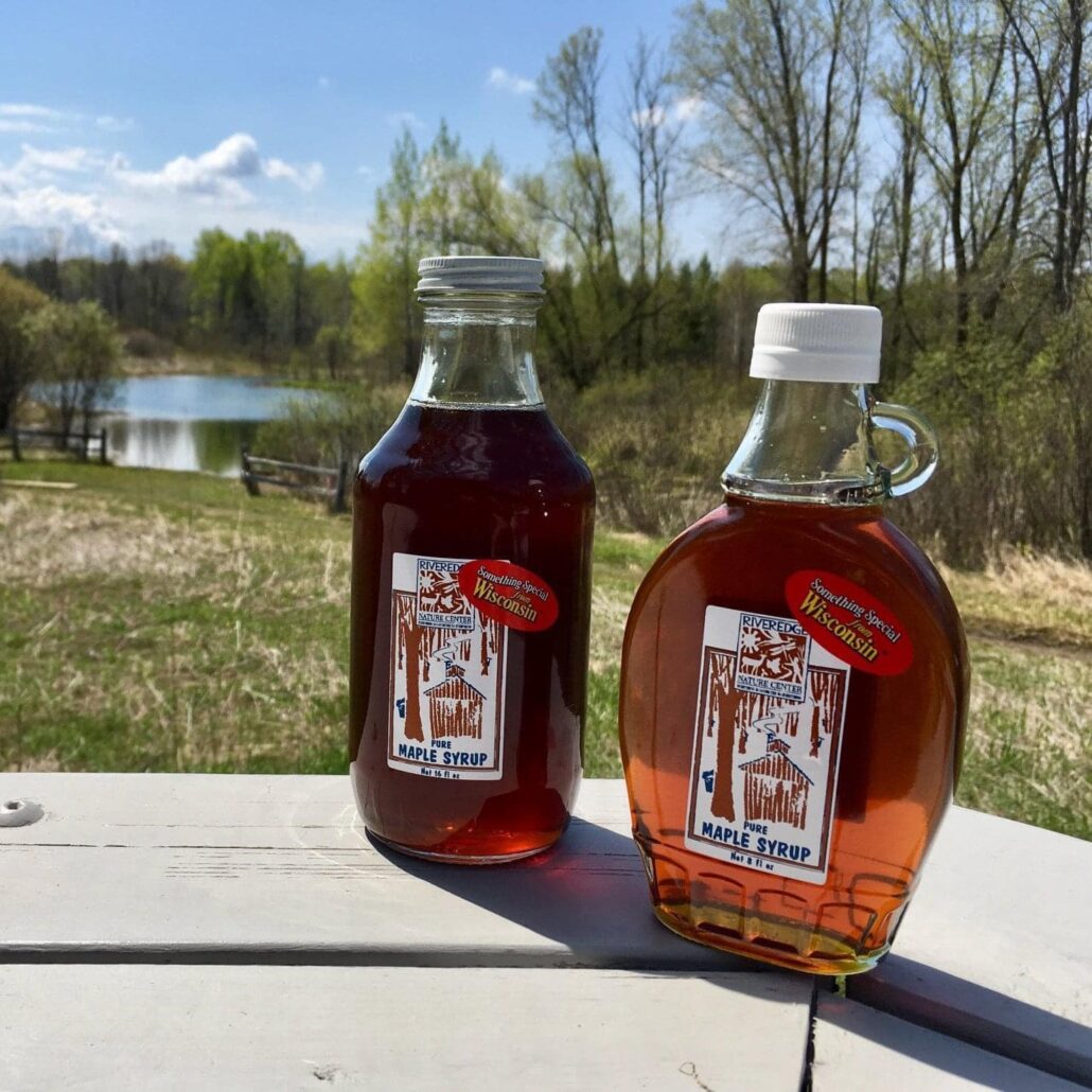 close up of 2 Riveredge maple syrup bottles