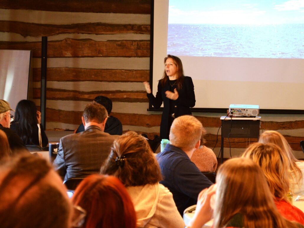 a speaker presenting research at the Student Research Symposium