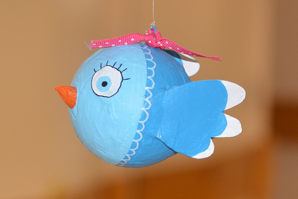 intricately painted paper bird